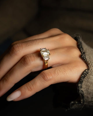 Emerald cut lab grown diamond three stone engagement ring in white gold setting