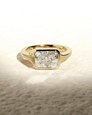 Radiant cut lab grown diamond bezel engagement ring in white gold setting