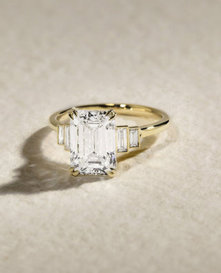 Emerald cut lab grown diamond five stone engagement ring in white gold setting