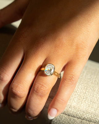 Cushion cut lab grown diamond bezel engagement ring in white gold setting