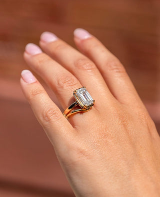 Emerald cut lab grown diamond bezel set solitaire engagement ring in white gold