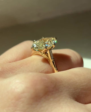 Marquise cut lab grown diamond three stone engagement ring in white gold setting