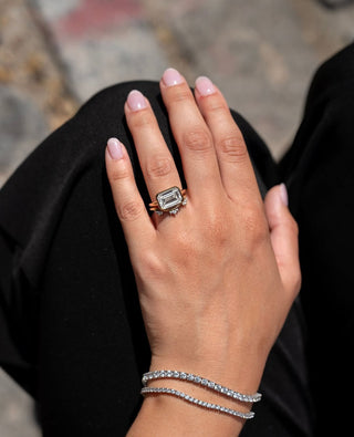 Elongated emerald cut lab grown diamond bezel solitaire engagement ring in white gold