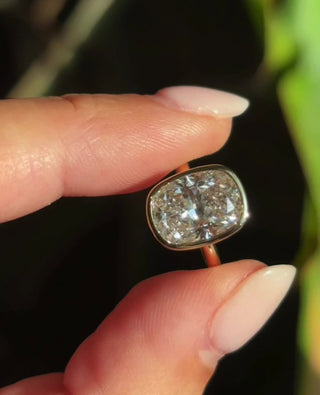 Radiant cut lab grown diamond bezel set solitaire engagement ring in white gold