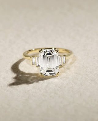 Emerald cut lab grown diamond five stone engagement ring in white gold setting