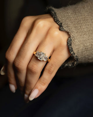 Emerald cut lab grown diamond three stone engagement ring in white gold setting