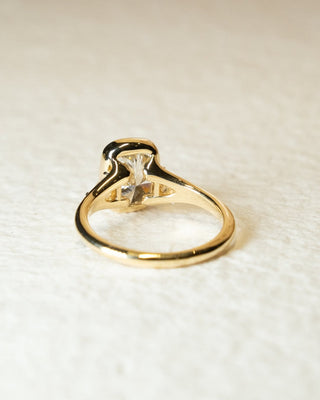 Cushion cut lab grown diamond bezel engagement ring with sleek white gold band