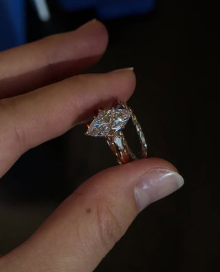 Marquise cut lab grown diamond three stone engagement ring in white gold setting