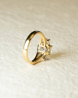 Emerald cut lab grown diamond three stone engagement ring in white gold setting